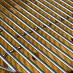 Primo Oval Junior 200 Ceramic Kamado Grill On Countertop Cypress Table With Stainless Steel Grates - PGCJRH - Image 3